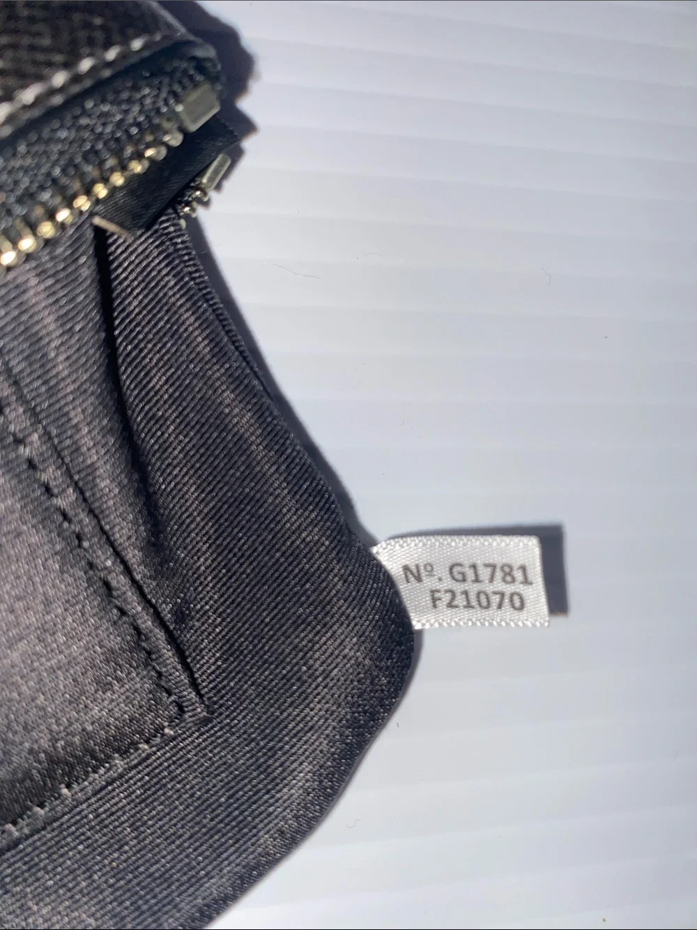 Coach Corner Zip Leather Wristlet in Silver and Black. F21070
